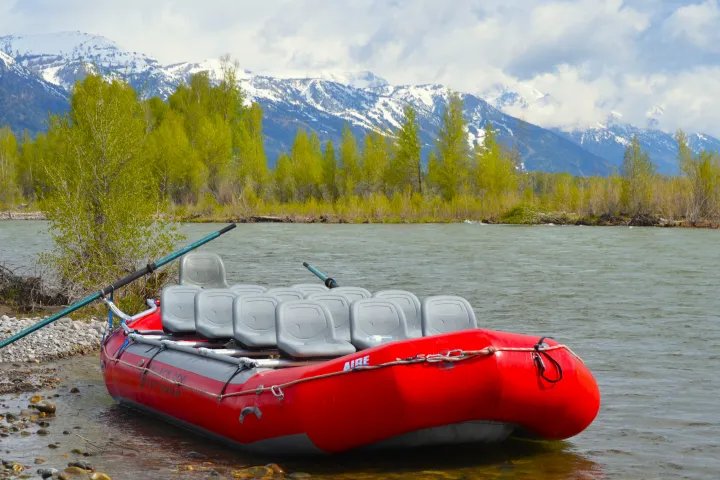 Red boat with custom frame on a Snake River scenic float in Jackson Hole